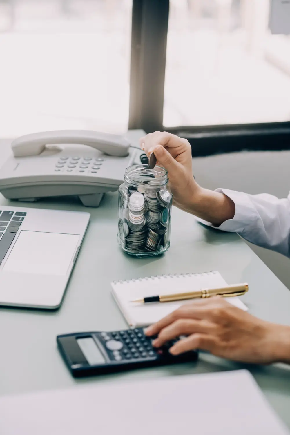 Business women put coin stack money and many bank note in office, Save money for future and Retirement.